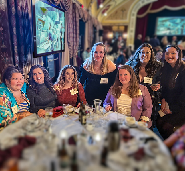 Roaring Fork Restaurant Group Catering Team smiling together at the 2025 company holiday party — your trusted local catering experts based in West Allis, Wisconsin.